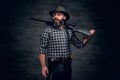 A hunter holds a rifle. Royalty Free Stock Photo
