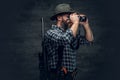 A hunter holds a rifle. Royalty Free Stock Photo
