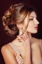 Studio portrait of a beautiful dark blond woman with evening hairdo and makeup Royalty Free Stock Photo