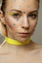 Studio portrait of beautiful girl with creative bright yellow makeup Royalty Free Stock Photo