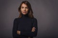 Studio portrait of a beautiful middle-aged woman looking at the camera against isolated background Royalty Free Stock Photo