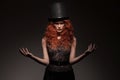 Redhead woman wearing black bowler hat Royalty Free Stock Photo