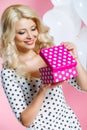 Studio portrait of a beautiful woman with a gift Royalty Free Stock Photo