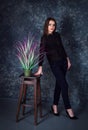 Studio portrait of beautiful young smiling woman wearing blue jeans and denim jacket Royalty Free Stock Photo