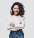 Studio portrait of a beautiful young woman with black curly hair. African american student girl close up isolated on white backgro