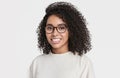 Studio portrait of a beautiful young woman with black curly hair. African american student girl close up isolated portrait Royalty Free Stock Photo