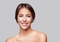 Studio portrait of a beautiful young woman with brown hair. Pretty model girl with perfect fresh clean skin. Beauty and skin care Royalty Free Stock Photo