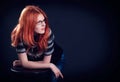 Studio portrait of the beautiful young woman with ginger hair Royalty Free Stock Photo