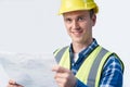 Studio Portrait Of Builder Architect Looking At Plans Against White Background Royalty Free Stock Photo