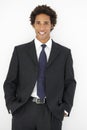 Studio Portrait Of Businessman Standing Against White Background