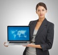 Weve gone global. Studio portrait of a businesswoman holding a laptop showing a world map with locations on it. Royalty Free Stock Photo