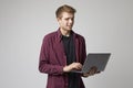 Studio Portrait Of Casually Dressed Businessman With Laptop Royalty Free Stock Photo