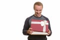 Happy handsome Caucasian man opening gift box ready for Valentin Royalty Free Stock Photo