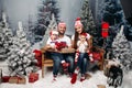 Happy family with kids at Christmas time. Royalty Free Stock Photo