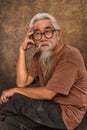 Chinese old man wearing eye glasses with white hair and beard Royalty Free Stock Photo