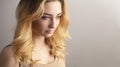 studio portrait of a confident young woman, girl face with curly hair disheveled from wind , the concept of natural beauty, Royalty Free Stock Photo