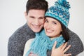 Studio Portrait Of Couple Wearing Warm Winter Clothes