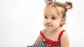 Studio portrait of cute, adorable, sad, upset, crying caucasian toddler girl in dress on isolated white background Royalty Free Stock Photo