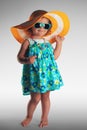 Studio portrait of cute baby girl with hat and sunglasses, summer concept Royalty Free Stock Photo