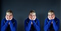 Studio portrait of a cute blond girl bored with heads in hands Royalty Free Stock Photo