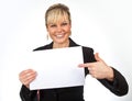 Studio portrait of a cute blond girl holding a piece of paper Royalty Free Stock Photo