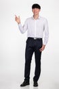 A studio portrait of an East Asian business man pointing at something and posing for a variety of poses Royalty Free Stock Photo