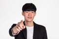 A studio portrait of an East Asian business man pointing at something Royalty Free Stock Photo