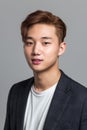 Studio Portrait of East Asian Businessman in Suit