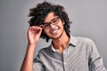 Arabian guy with curly hair on gray isolated background