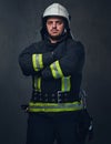 Studio portrait of firefighter dressed in uniform.