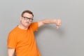 Portrait of funny man giving thumb down sign of disapproval Royalty Free Stock Photo