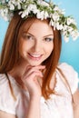 Studio portrait of a girl in wreath of flowers Royalty Free Stock Photo