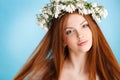 Studio portrait of a girl in wreath of flowers Royalty Free Stock Photo