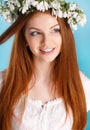 Studio portrait of a girl in wreath of flowers Royalty Free Stock Photo