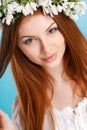 Studio portrait of a girl in wreath of flowers Royalty Free Stock Photo