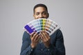 Studio Portrait Of Graphic Designer With Color Swatches