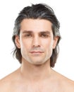 Hes one seriously good looking guy. Studio portrait of a handsome, shirtless man posing against a white background. Royalty Free Stock Photo