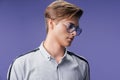 Handsome young guy in stylish eyewear while looking away. Stylish haircut. Fashion man Royalty Free Stock Photo