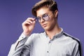 Handsome young guy in stylish eyewear while looking away. Stylish hairstyle. Fashion man Royalty Free Stock Photo