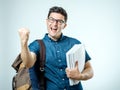 Studio portrait of handsome young man with backpack Royalty Free Stock Photo