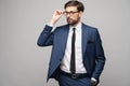 Portrait of a handsome young stylish businessman wearing glasses over grey background Royalty Free Stock Photo