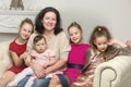 Studio Portrait of Happy Family of Mother and Three Daughters Royalty Free Stock Photo