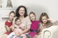 Studio Portrait of Happy Family of Mother and Three Daughters Royalty Free Stock Photo