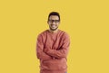 Portrait of happy young black man in glasses standing isolated on color background Royalty Free Stock Photo