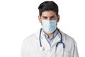 Studio portrait of male doctor wearing surgical mask while standing at isolated white background Royalty Free Stock Photo