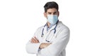 Studio portrait of male doctor wearing surgical mask while standing at isolated white background Royalty Free Stock Photo