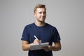 Studio Portrait Of Male Sports Coach With Clipboard