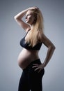 Studio Portrait of a Pregnant Blond Woman