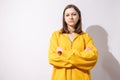 Studio portrait of pretty young teenage girl posing on white background. Royalty Free Stock Photo