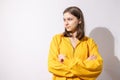 Studio portrait of pretty young teenage girl posing on white background. Royalty Free Stock Photo